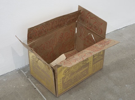 Danh Vo, “Promised Land,” 2013. Gold, ink and cardboard, 14 x 19 x 15”. Courtesy of the artist and Marian Goodman Gallery, New York.