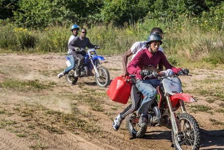 On tracks built into the dunes of Gerritsen Beach, teens drive dirtbikes with precision, fearlessly racing across the sand.
