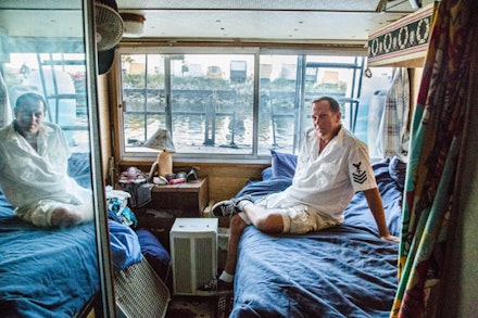 Darren, better known by his neighbors as Captain Seaweed, spent his life in different cities surrounded by water, before settling into his house boat on the bay.