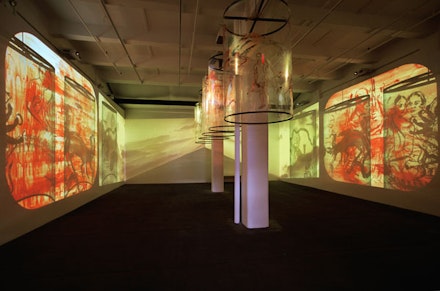 Nalini Malani’s installation “In Search of Vanished Blood” 2012, six-channel video/shadow play with five rotating reverse painted Mylar cylinders, sound, 11 minutes, total dimensions variable, edition of 3; at Lelong, © Nalini Malani, Courtesy of Galerie Lelong, New York.