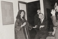 The artist with Iris Clert at the opening of his exhibition at Galerie Iris Clert, in Paris, June 1963.