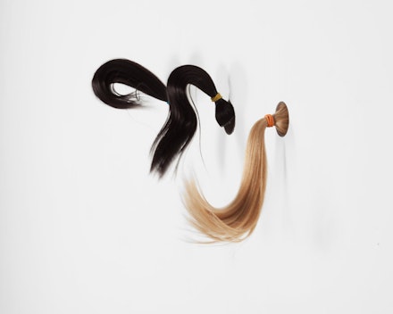 Mika Rottenberg, “Ponytails,” 2014. Hair, wood, acrylic tubing, mechanical system, nylon mono filament, ponytail holders, acrylic paint dimensions variable, overall approximately: 108 to 180 × 24 × 9 inches. Edition 1 of 3 with one artist’s proof. Courtesy of Andrea Rosen Gallery.