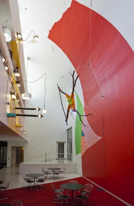 Jessica Stockholder, <i>Rose's Inclination</i>, 2015. Paint, carpet, fragment of Judy Ledgerwood's painting, branches, rope, Plexiglas, light fixtures, hardware, extension cord, mulch, Smart Museum foyer, courtyard, and sidewalks. Courtesy of the artist, Mitchell-Innes & Nash Gallery, and Kavi Gupta Gallery.