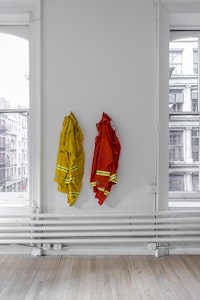 Cameron Rowland, <i>1st Defense NFPA 1977, 2011</i>, 2016. Nomex fire suit, distributed by CALPIA, 50 x 13 x 8 inches. Rental at cost.“The Department of Corrections shall require of every able-bodied prisoner imprisoned in any state prison as many hours of faithful labor in each day and every day during his or her term of imprisonment as shall be prescribed by the rules and regulations of the Director of Corrections.” - California Penal Code 2700CC35933 is the customer number assigned to the nonprofit organization California College of the Arts upon registering with the CALPIA, the market name for the California Department of Corrections and Rehabilitation, Prison Industry Authority. Inmates working for CALPIA produce orange Nomex fire suits for the state's 4300 inmate wildland firefighters.Courtesy of the artist and ESSEX STREET, New York. Photo: Adam Reich.