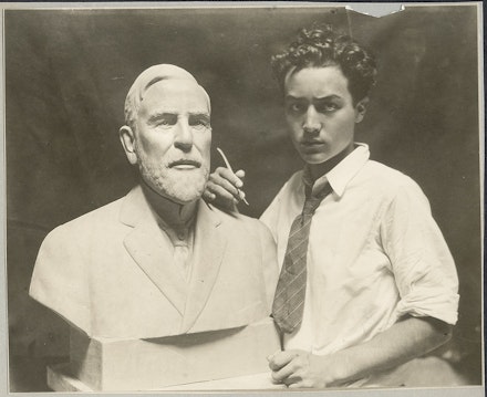 Isamu Noguchi in studio at work on bust of E.H. Scott, 1924. © The Isamu Noguchi Foundation and Garden Museum, New York / ARS.