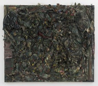 Thornton Dial, <em>The Color of Money: The Jungle of Justice</em>, 1996. Fabric, shoe, gloves, jigsaw puzzle pieces, artificial flowers and plants, dolls, stuffed animals, rope carpet, toys, cotton, found metal, other found materials, oil, enamel, spray paint, industrial sealing compound, on canvas mounted on wood. 77 x 86 x 12 inches. Courtesy David Lewis, New York. © Estate of Thornton Dial. Collection of the Souls Grown Deep Foundation.