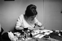 Eva Hesse painting at photographer's studio, circa 1963. Photo: Barbara Brown. 