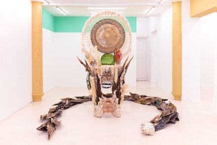 Guadalupe Maravilla, <em>Disease Thrower #5</em>, 2019. Mixed media sculpture, shrine, instrument, headdress, 91 x 55 x 45 inches. Courtesy Jack Barrett Gallery, New York.