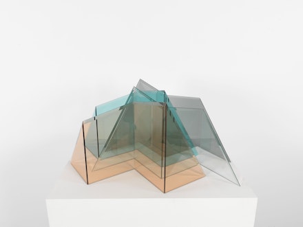 Larry Bell, <em>Glacier</em>, 1999. Pink Rosa tinted glass, Azure Blue tinted glass, Light Grey tinted glass, Clear glass, 16 x 29 1/2 x 35 inches. © Larry Bell. Private collection. Photo: Christopher Burke.
