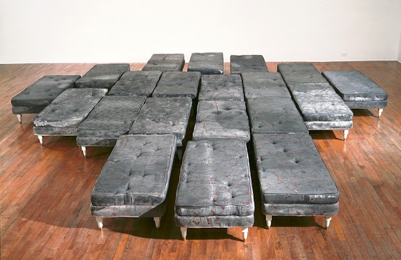 Guillermo Kuitca, Untitled, 1992. Acrylic on mattress with wood and bronze legs, 20 beds; 15 3/4 x 23 5/8 x 47 1/4 inches each. Tate, London. © Guillermo Kuitca. Courtesy the artist and Sperone Westwater, New York.
