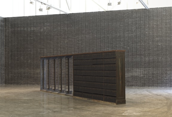 Theaster Gates,<em> Walking Prayer,</em> 2018–20. Bound embossed books and vintage Carnegie cast iron shelving, 83 x 320 x 19 inches. © Theaster Gates. Photo: Robert McKeever. Courtesy Gagosian.