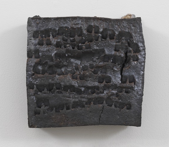 Theaster Gates, <em>Brick Reliquary - Square with Marks</em>, 2020. Wood fired brick, wood ash, magnesium dioxide, and black stain, 12 x 12 x 4 inches. © Theaster Gates. Photo: Robert McKeever. Courtesy Gagosian.