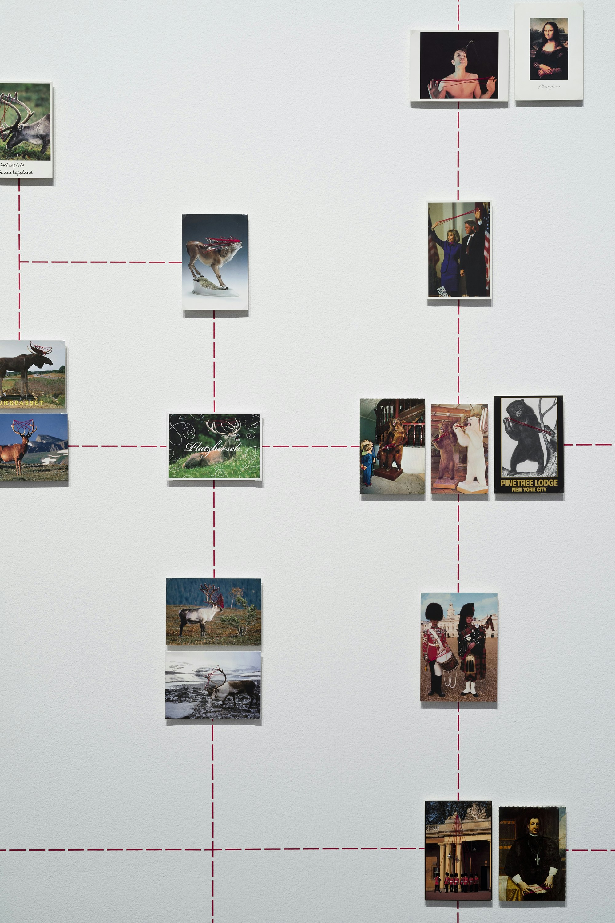 Nina Katchadourian, <em>Paranormal Postcards</em> (detail), 2001–ongoing. Mounted postcards, red sewing thread, red graphic tape on wall, dimensions variable. © Nina Katchadourian. Courtesy Pace Gallery.