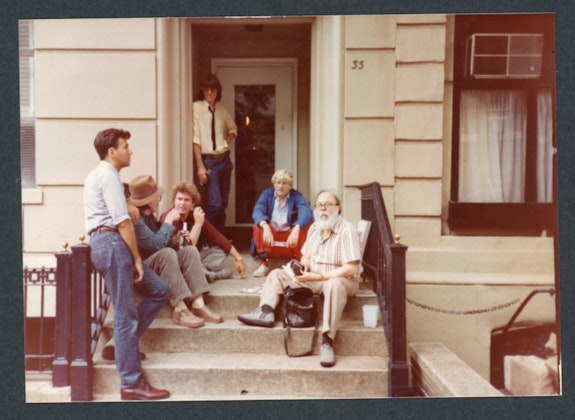 L to R: Diego Cortez, Don Van Vliet, Bradford Morrow, David Fricke, David Hockney, Henry Geldzahler. 33 West 9th Street, NYC, 1982. Photo: Raymond Foye.