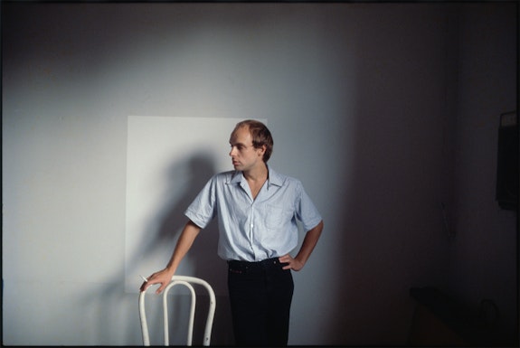 Brian Eno in Steve Mass's apartment on 8th Street, New York City, 1978. Photo by Roberta Bayley.