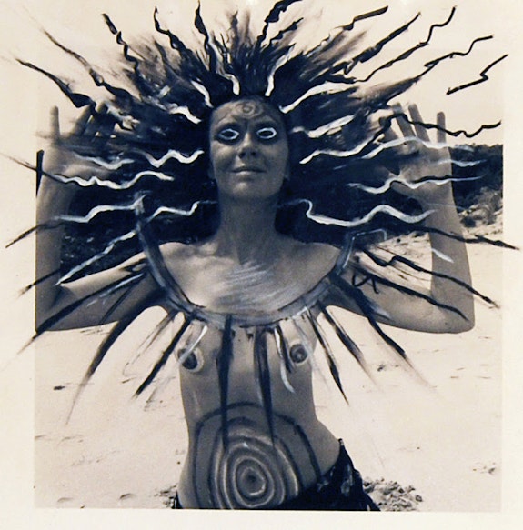 Mary Beth Edelson, <em>Woman Rising Higher Spirit, </em>1975. China marker on silver gelatin print, 8 x 9 inches.