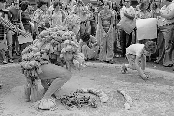 Betsy Damon, <em>7,000 Year Old Woman</em>, performance on Prince Street, New York, May 21, 1977. Archival Print. © Betsy Damon 1977/2021. Courtesy the artist.