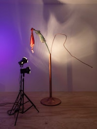 Sahra Motalebi, <em>Resonator #1 (404)</em>, 2022. Copper, satin, speaker, spray paint, steel, led bulbs, lights and stands, dimensions variable. Courtesy the artist and Brief Histories, New York.