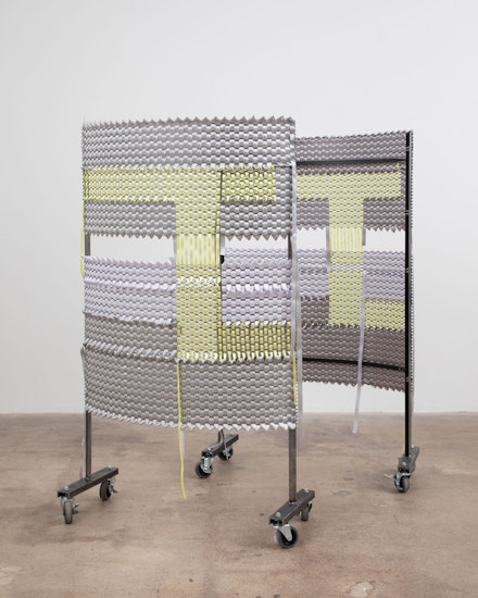 Alina Tenser, <em>Parentheses, Yellow Path</em>, 2022. Satin ribbon, steel, expanded metal, casters, 56 1/2 x 33 x 14 inches. Courtesy of the artist and HESSE FLATOW. Photo: Jenny Gorman.