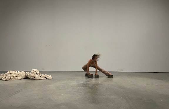 Sayer Mansfield performing <em>new skin</em> at Art Cake, Brooklyn, 2022. Photo courtesy Jaqueline Hall and the artist.