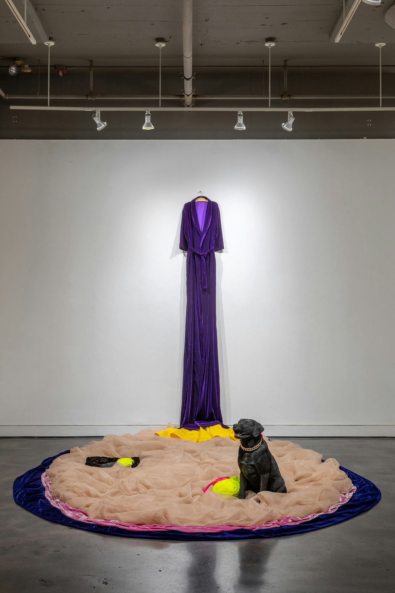 Beverly Semmes, <em>Marigold</em>, 2022. Velvet, organza, faux fur, silk, Alexander McQueen dress, stuffed and taped AMQ clutch purse and strap, taped AMQ shoes, painted plastic resin dog with AMQ clutch purse chain, 118 x 118 x 171 inches. Courtesy Locks Gallery, Philadelphia.