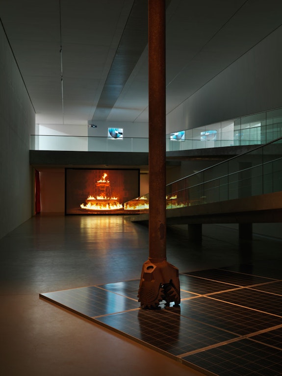 Installation view: <em>Julian Charrière: Controlled Burn</em>, Langen Foundation, Neuss, Germany, 2022. Featuring: Julian Charriére, <em>Mining The Sky</em>, 2022; <em>Beneath It All Flows Liquid Fire</em>, 2019; <em>Pure Waste</em>, 2021. Copyright the artist; VG Bild-Kunst, Bonn, Germany. Photo: Jens Ziehe.