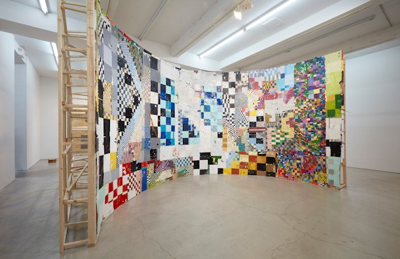 william cordova, <em>can't stop, won't stop (rumimaki-krsoneogun)</em>, 2024. Reclaimed paint chips, oil, and ink on paper, lumber, 144 x 360 inches. Courtesy Sikkema Jenkins & Co.