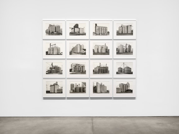 Bernd & Hilla Becher, <em>Grain Elevators</em>, 1977-91. 16 gelatin silver prints, each: 11 7/8 x 15 ¾ inches, overall: 74 3/8 x 90 1/8 inches. Signed by Max Becher and estate stamped. Courtesy the artist and Paula Cooper Gallery. Photo: Steven Probert.