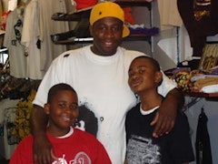 Joshua Brown with his sons inside the B Shop in East New York. Photo by Terésa Stern.